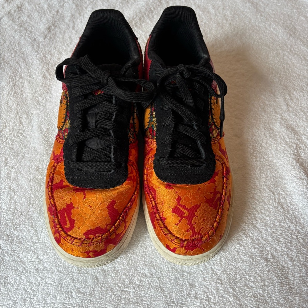 Orange and Black and Red Youth size 5.5 equal to Women’s size 7 Gently worn.
